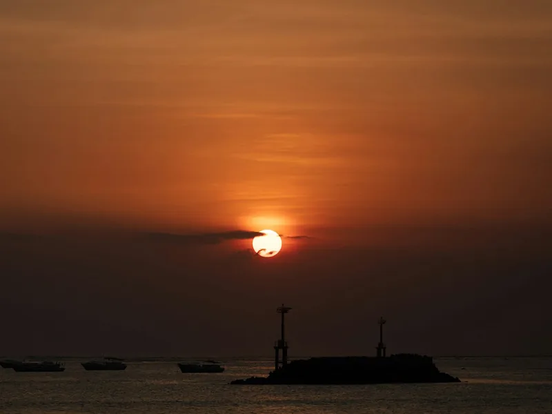 Sunset over the fishing boats at Jimbaran Beach
