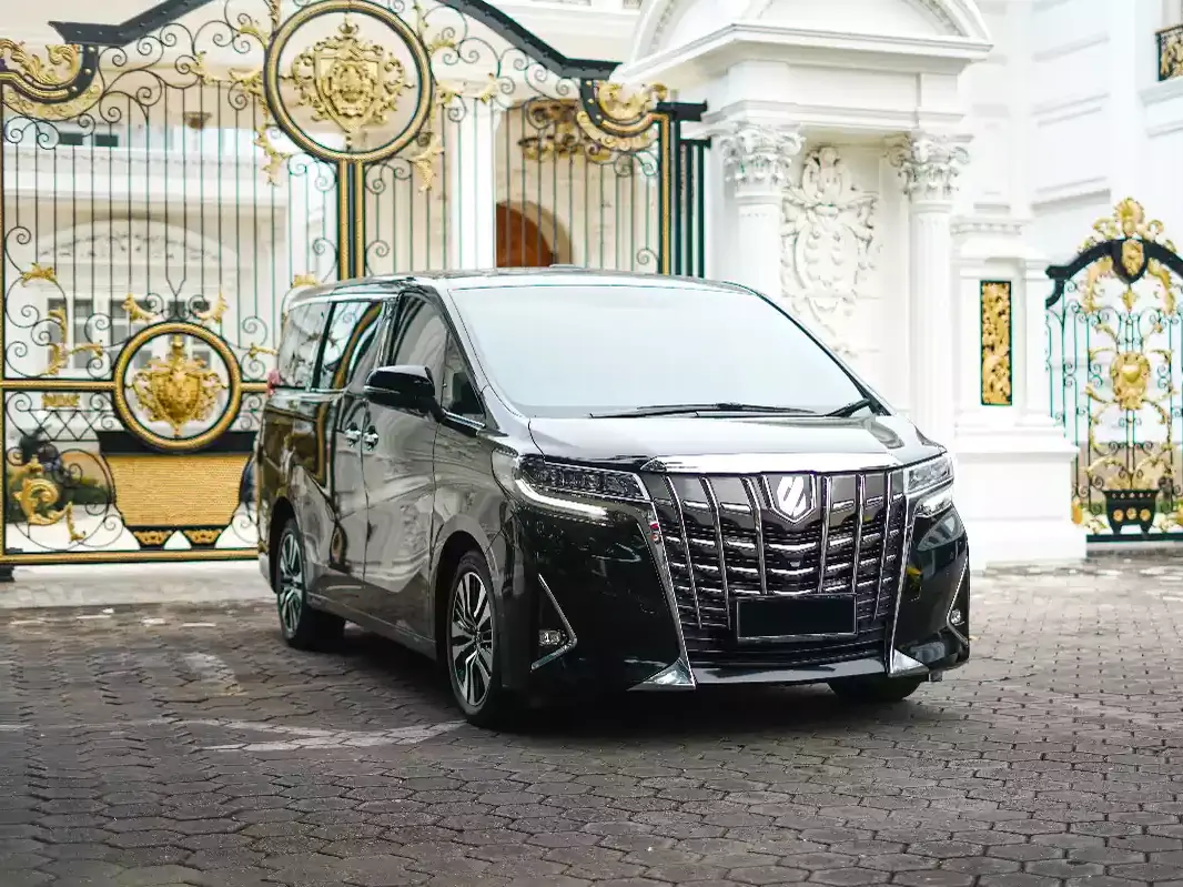 Private transfer vehicle waiting at a villa gate