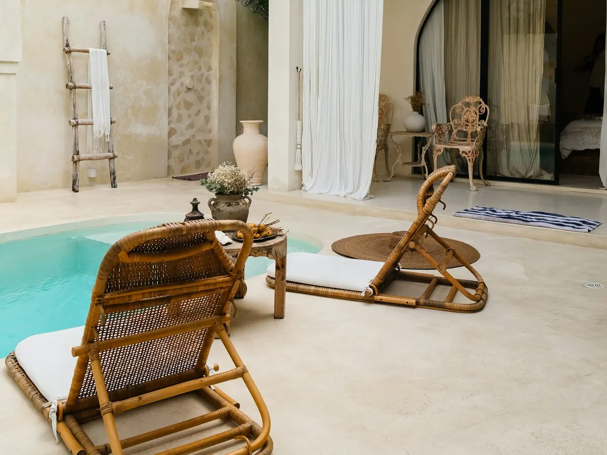 Lounge chairs beside a villa plunge pool