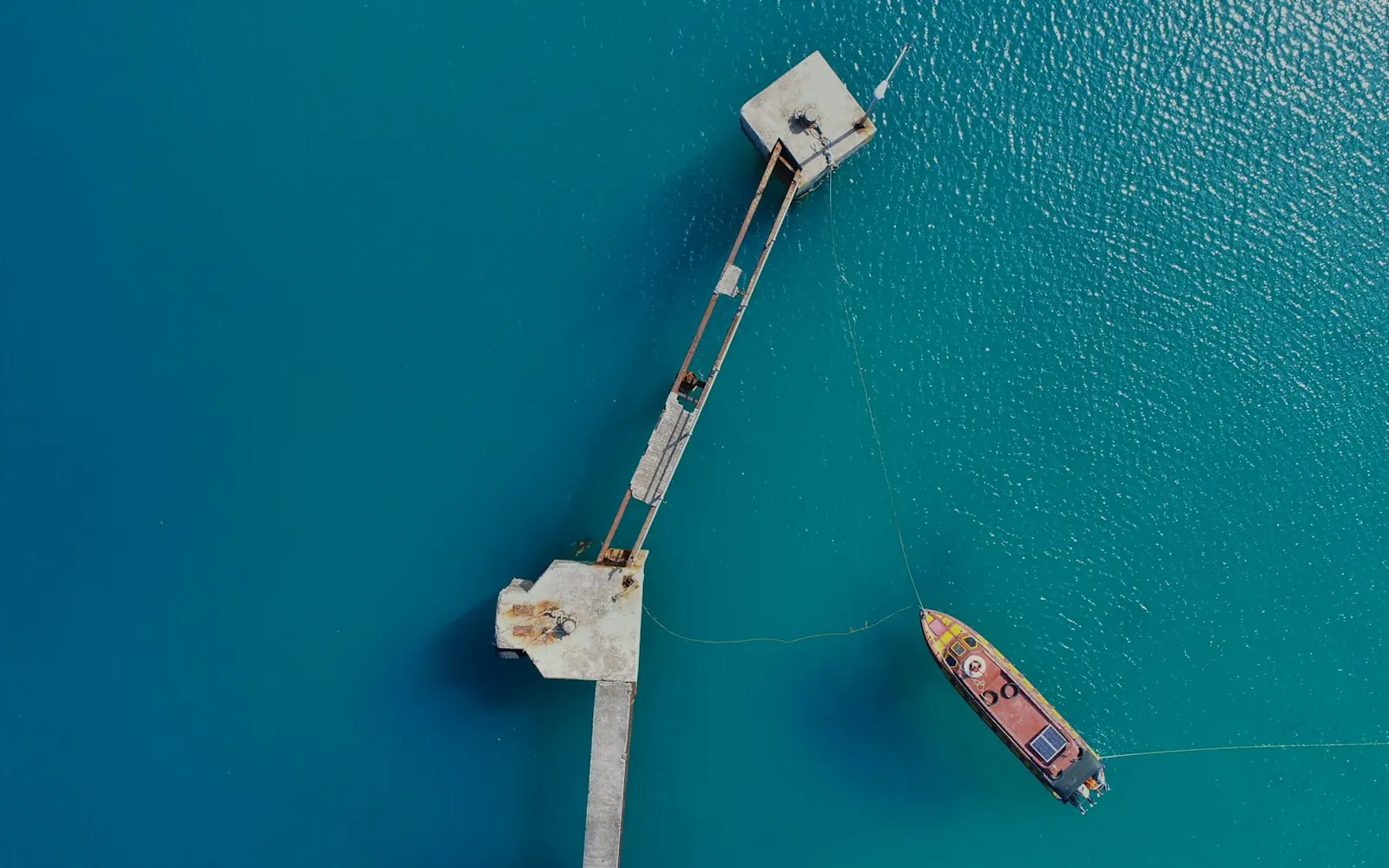 Aerial view of a boat beside a jetty off Juanga, South Morotai