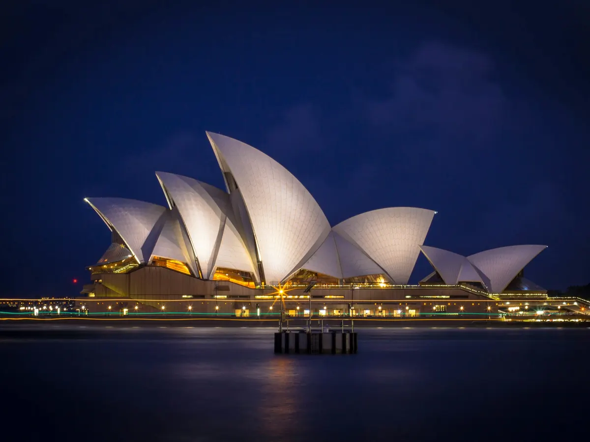 Sydney Opera House lit up at night