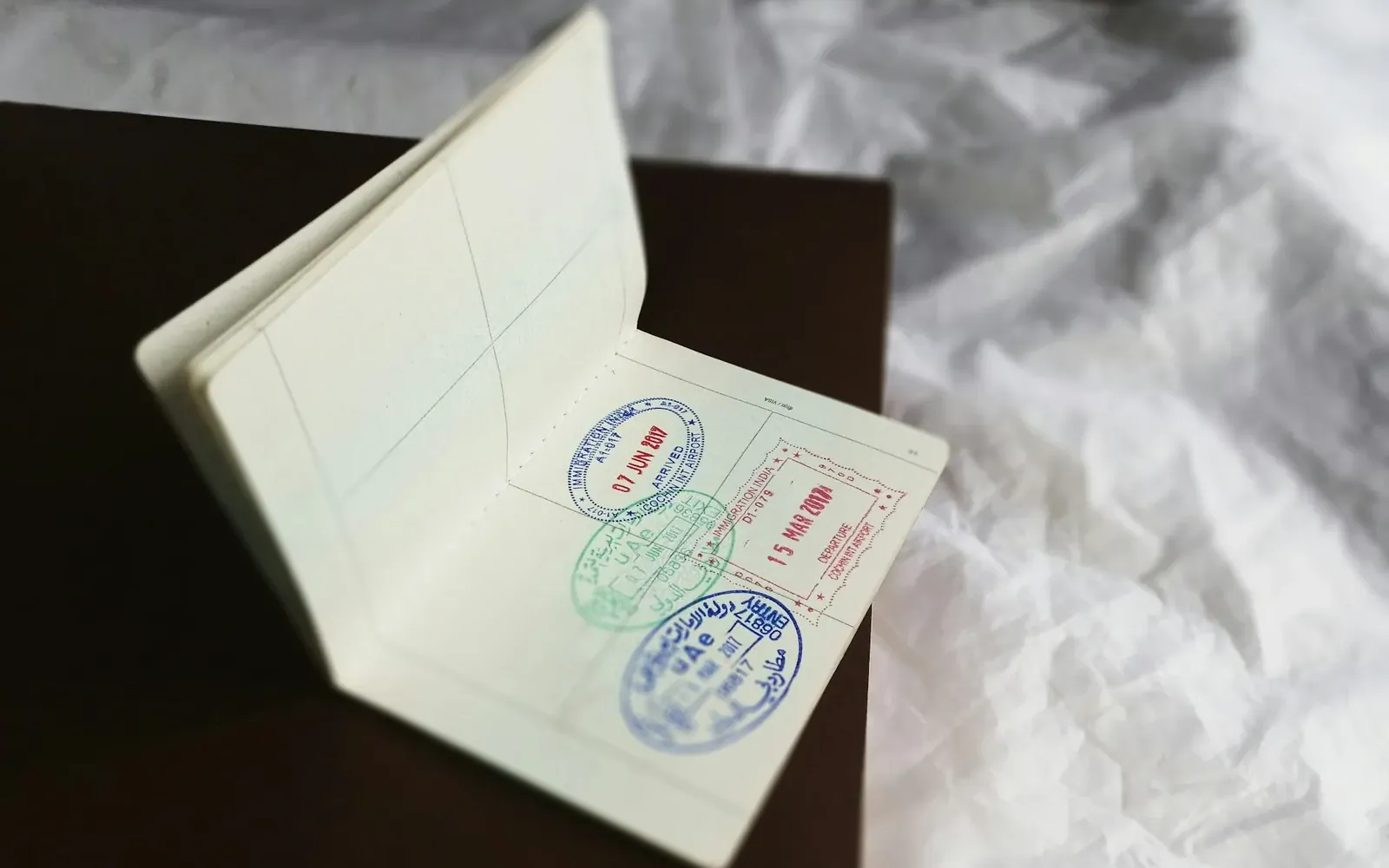 Open passport page with entry stamps