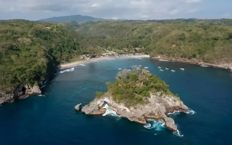 Aerial view of Crystal Bay and its rocky islet on Nusa Penida